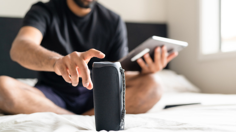 man using bluetooth speaker