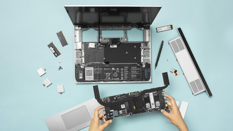 A Framework Laptop 16, broken down into multiple parts.