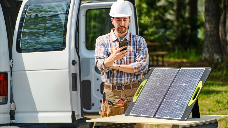 Ryobi foldable solar panel charging a phone