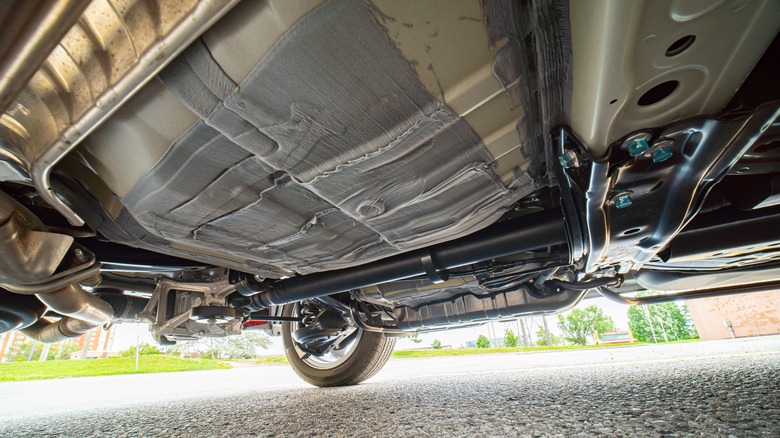 view of underside of car with engine splash shield