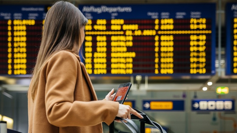 A rear shot of a female traveler at the airport