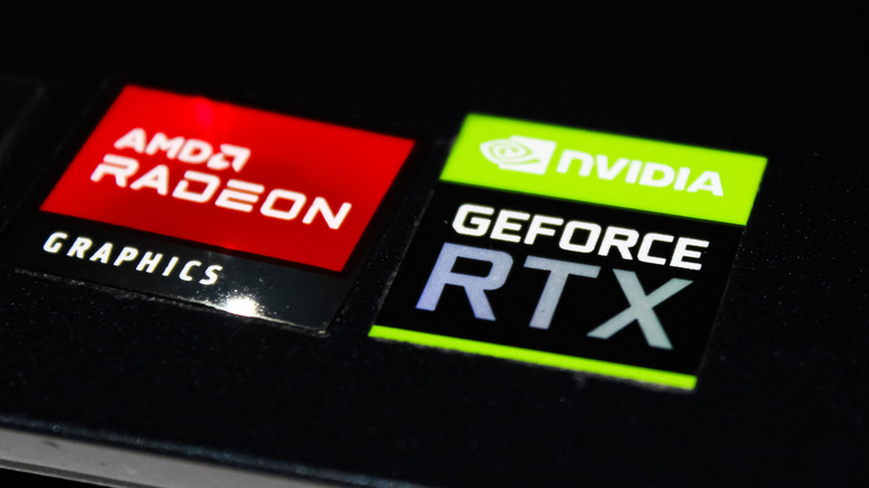 AMD Radeon and NVIDIA GeForce RTX logos on laptop