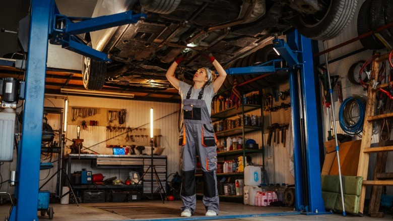 mechanic working under car