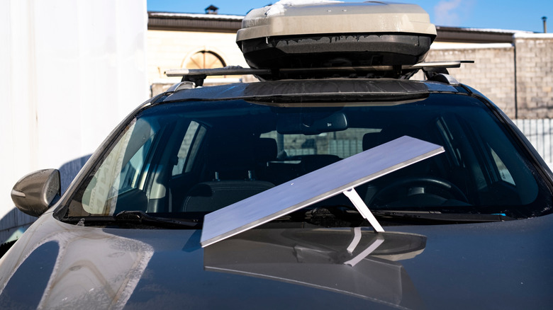 A Starlink dish on the hood of a car