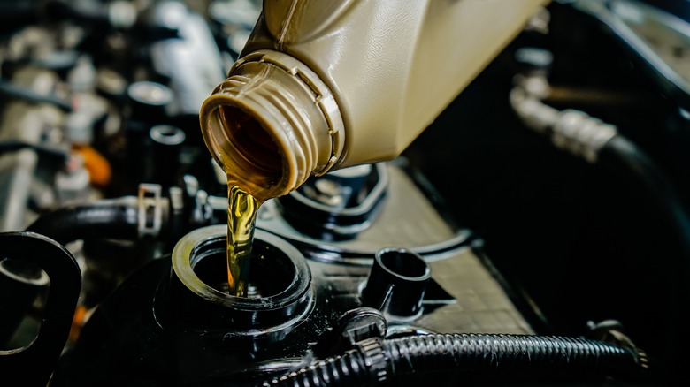 Refilling car engine with fresh oil