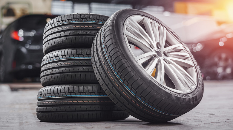 A stack of car tires on the ground.