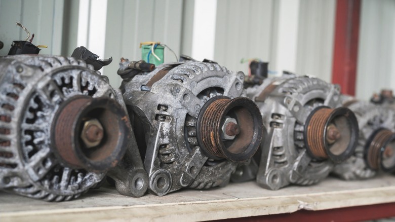 several old car alternators that can be recycled