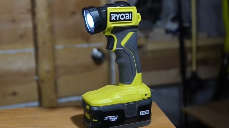 A Ryobi flashlight on a table