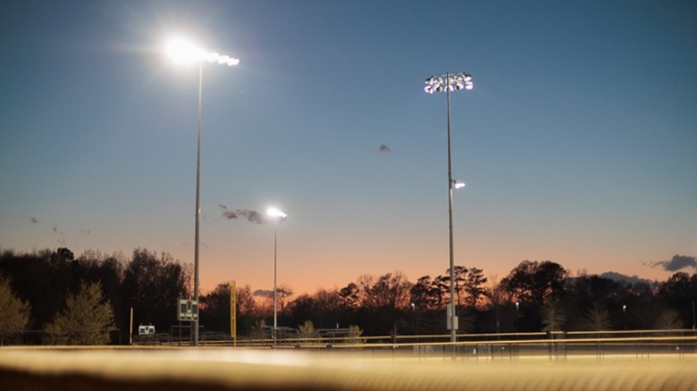 Baseball field lights at dusk