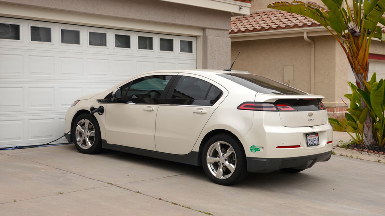 Chevrolet Volt charging in front of a home