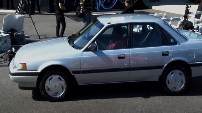 Alfred Morris with his 1991 Mazda 626