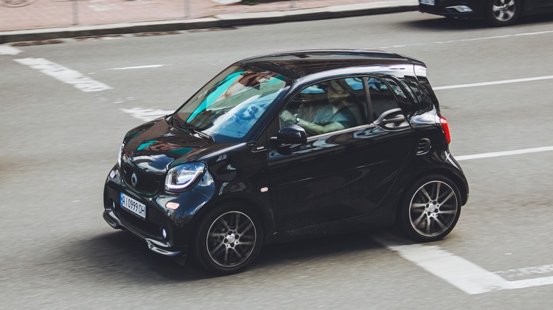 Smart Fortwo driving down street