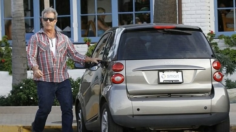 Mel Gibson with his Smart car