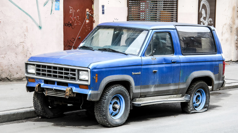 Abandoned Ford Bronco II on the street