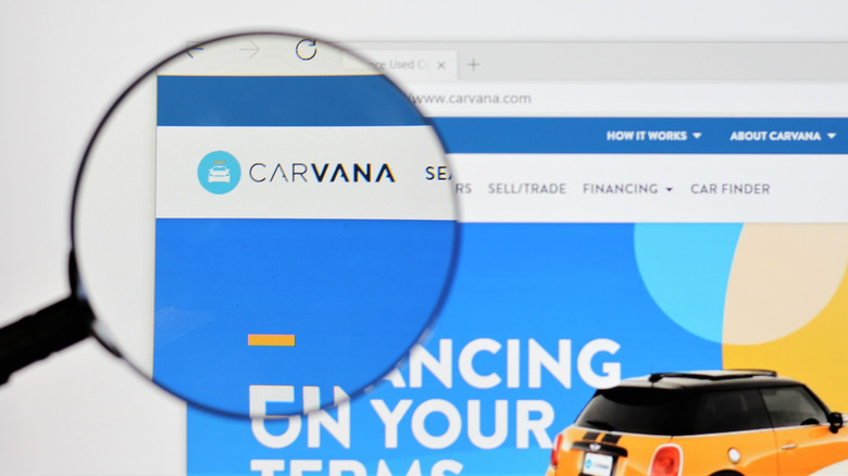 Carvana website seen through magnifying glass