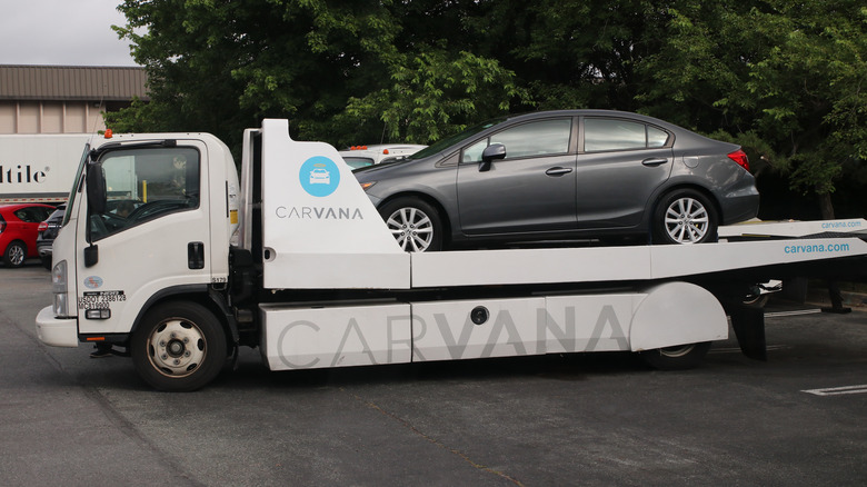 Carvana delivery truck with customer car