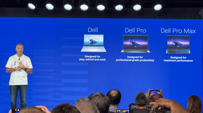 Man stands on stage with Dell branding