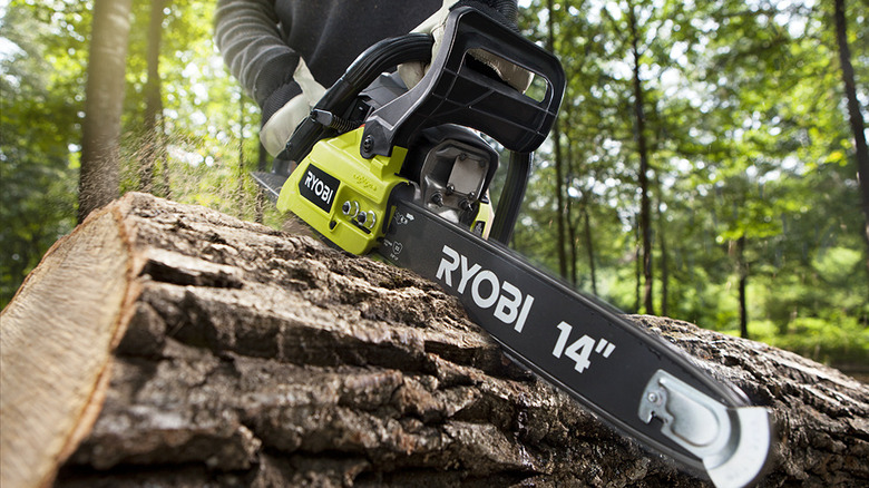 Ryobi chainsaw cutting through log