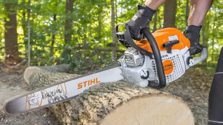 Stihl chainsaw cutting through log