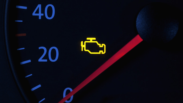 illuminated Check Engine light on a vehicle dashboard