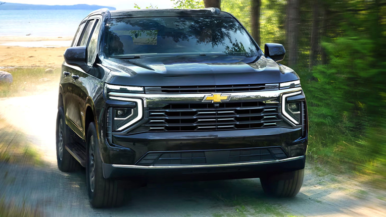 Chevy Tahoe driving down dirt path