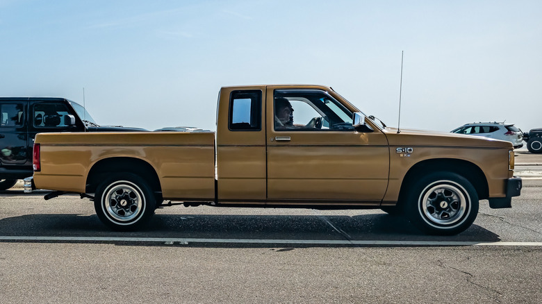 Gold Chevrolet S10 in parking lot