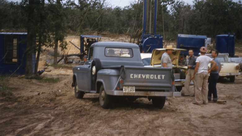 Blue Chevrolet pickup truck on work site