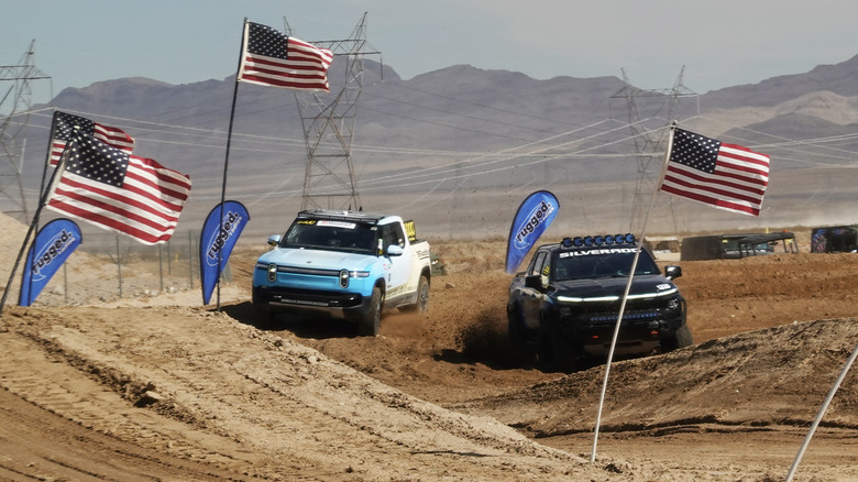 Chevrolet Silverado EV ZR2 ripping past a Rivian R1T