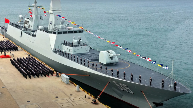 Chinese sailors stand at attention as the Luohe officially sets sail.