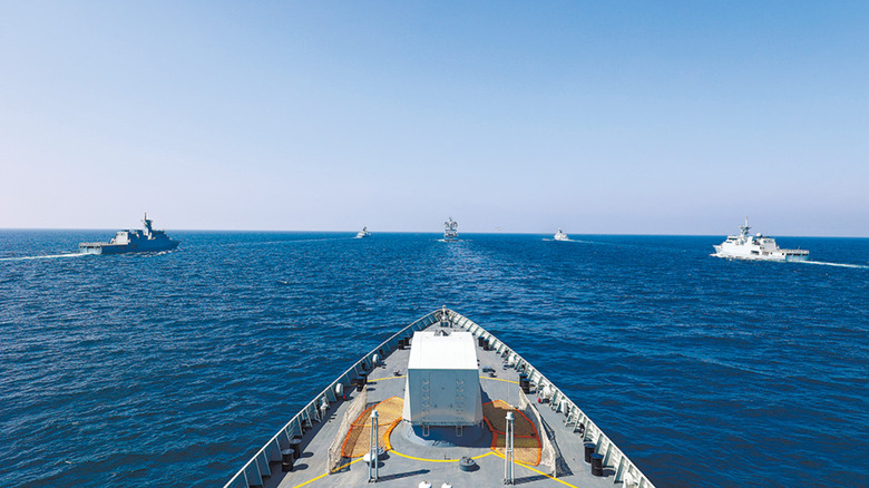 A fleet of Chinese warships set sail in formation.