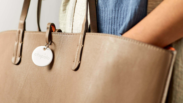 Chipolo One tracker on purse