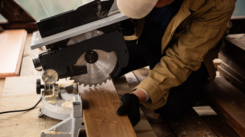 wood under a miter saw