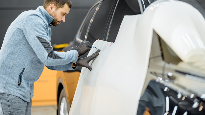 Man wrapping a car