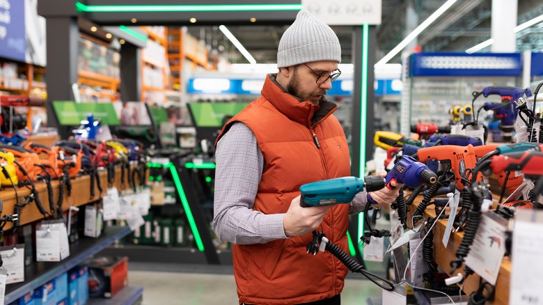 A man buying power tools.