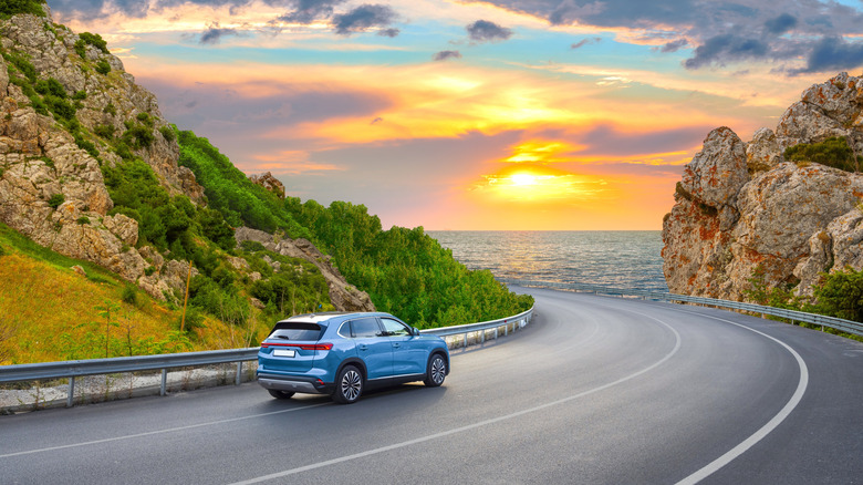 Blue car on highway