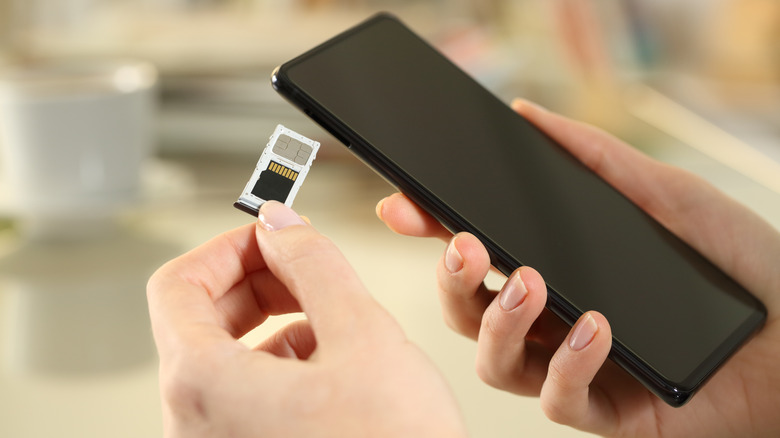 Inserting a memory card into a smartphone 