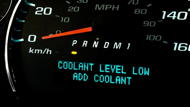 Low coolant level warning on car instrument panel