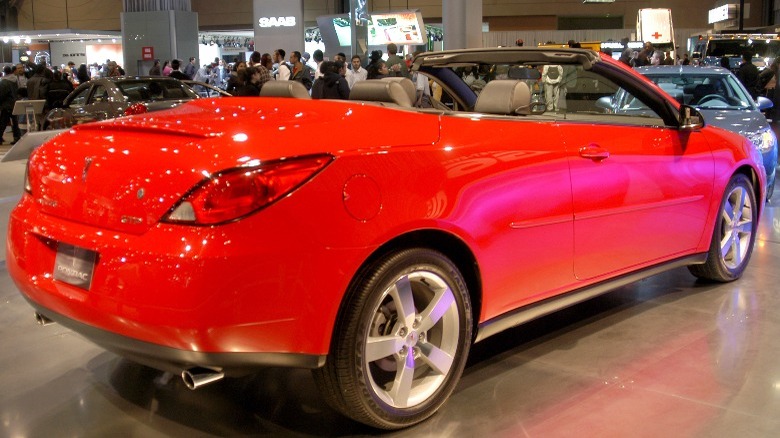 A three-quarters rear view of a red Pontiac G6 convertible