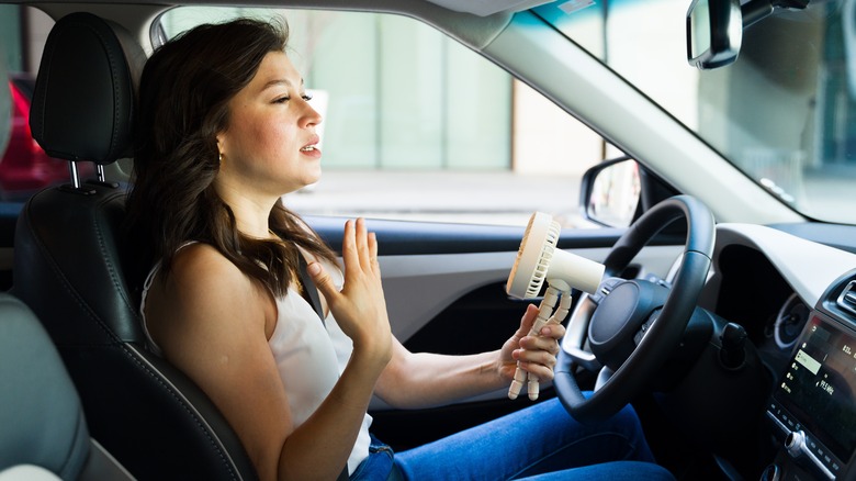 Driver fanning herself