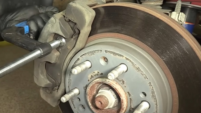 Person servicing truck brakes