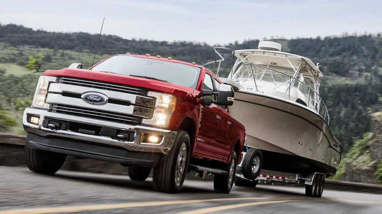 2018 Ford F-250 pulling a boat on the highway