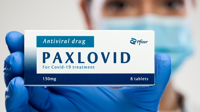 Person holding Paxlovid