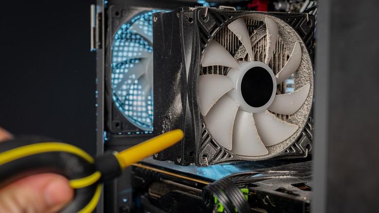 Close up of hand cleaning CPU fan