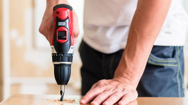 Person using Craftsman drill