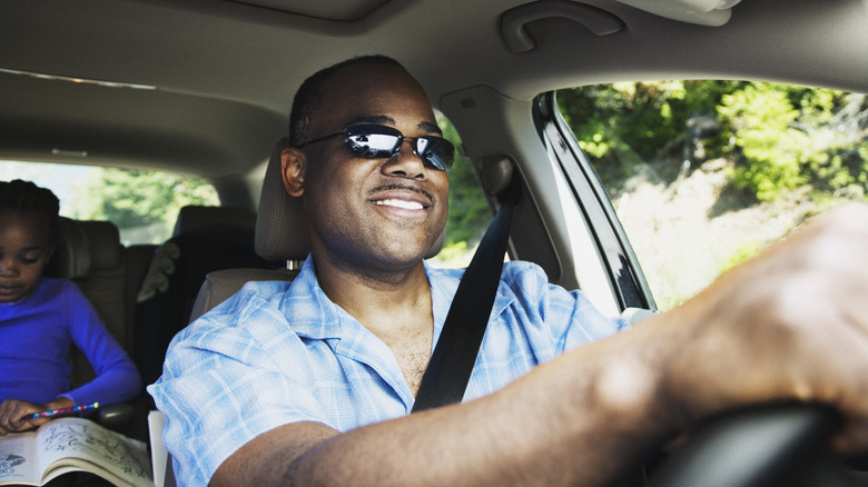 Driver behind wheel of car