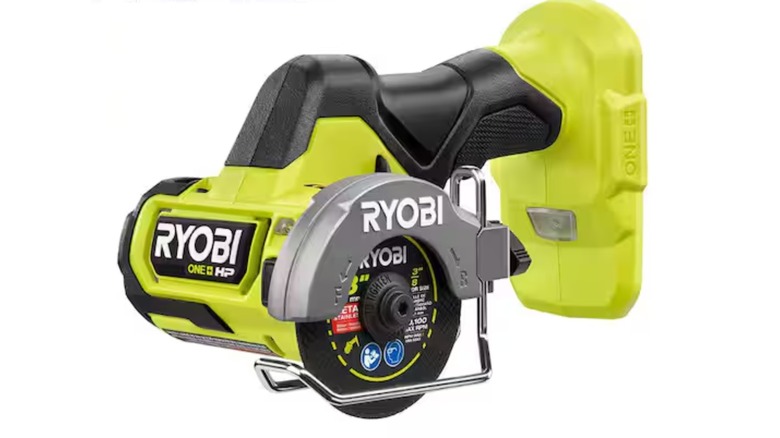 A Ryobi cut-off tool on white background