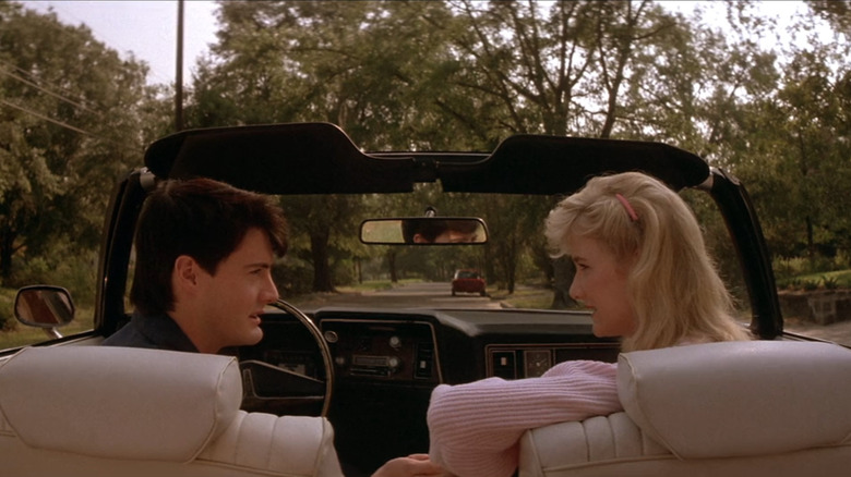 Jeffery (Kyle MacLachlan) and Sandy (Laura Dern) talk in a car in Blue Velvet