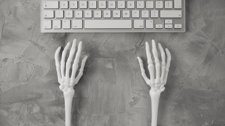 Skeletal hands at a keyboard