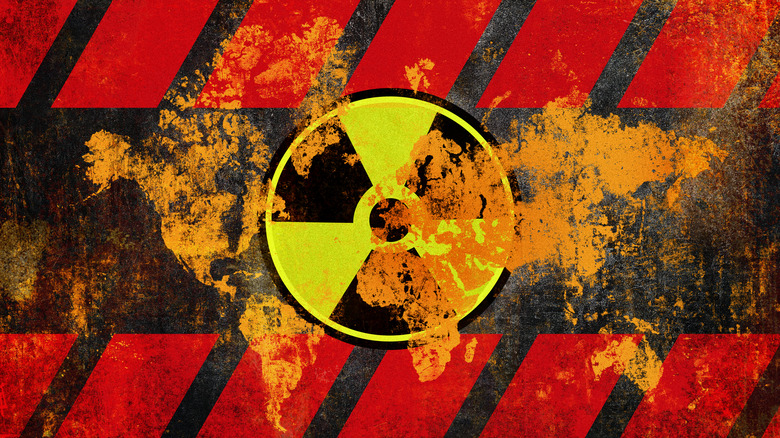 A nuclear warning superimposed over a world map.