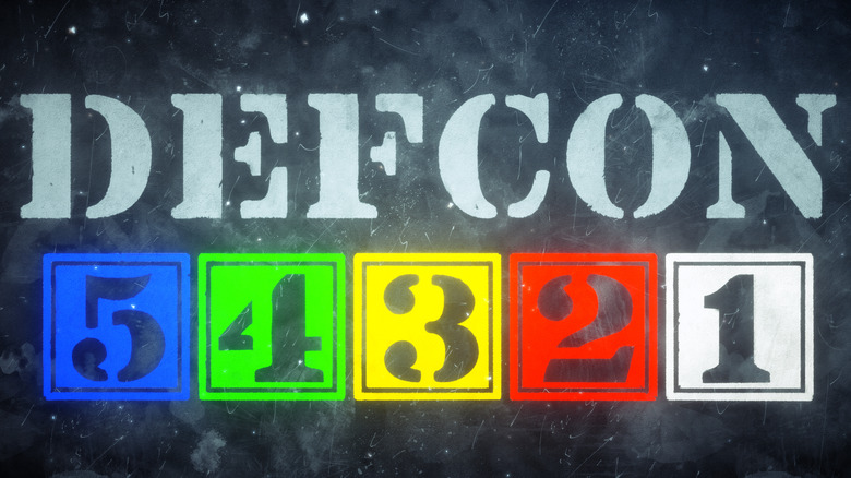 DEFCON levels in stencil form, with the numbers colored on a black background.